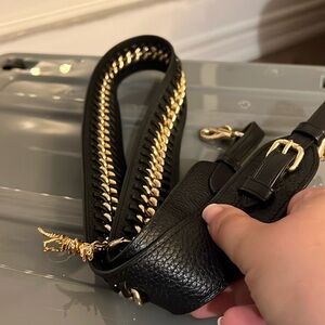 Coach handbag strap with Rexy accessory